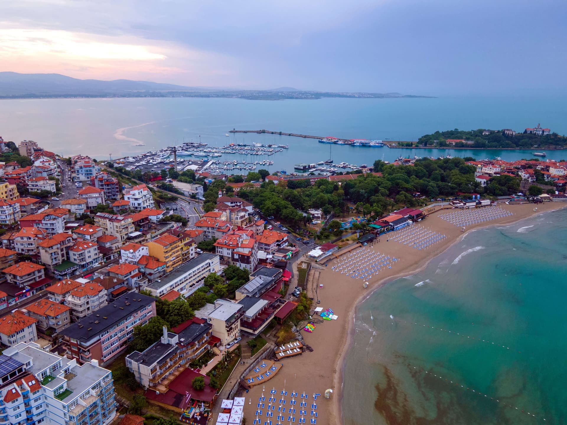 Aerial view of Sozopol, with its marina, red-roofed old town and sandy beach