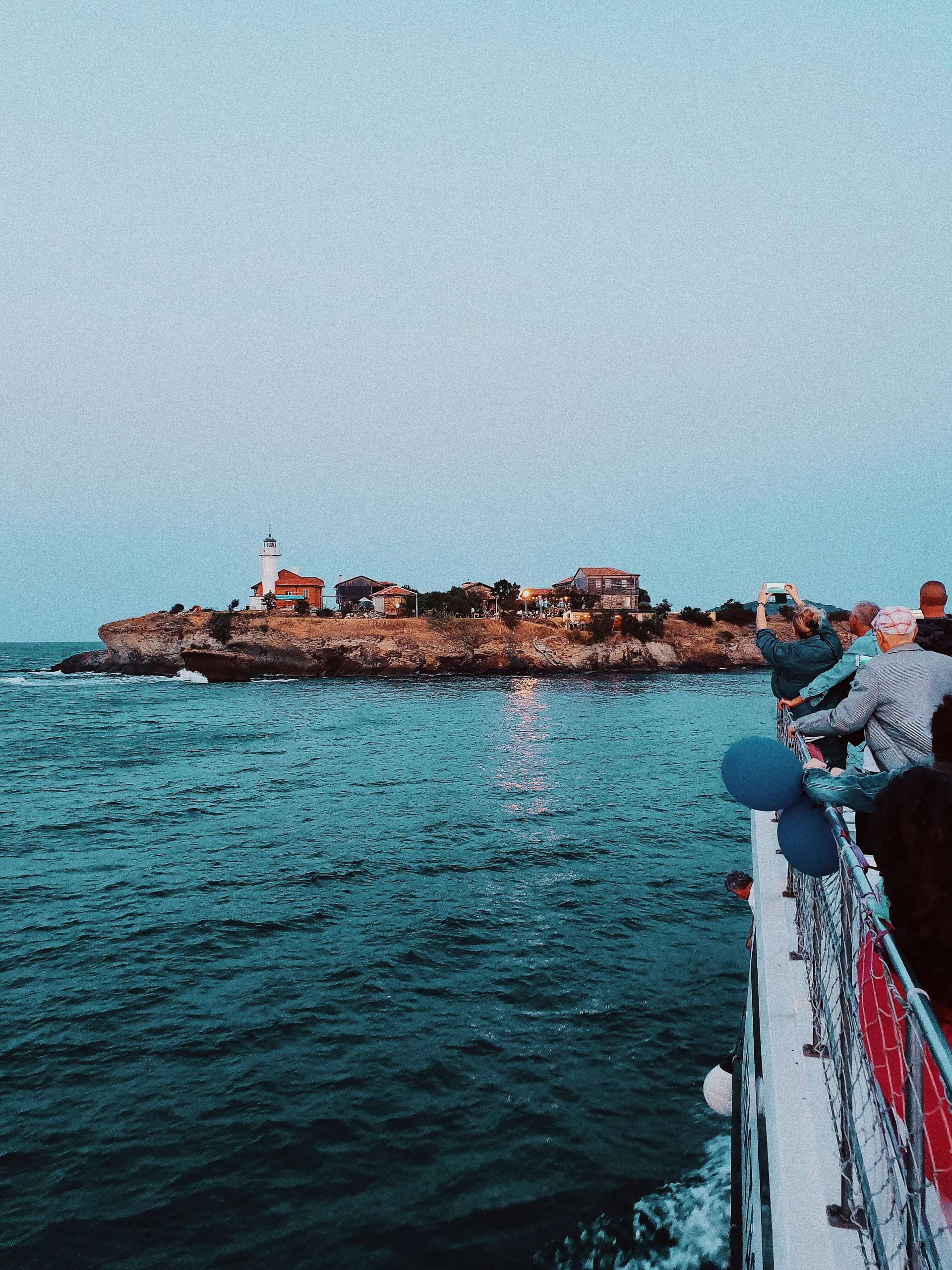 St Anastasia Island and its lighthouse in Burgas Bay, seen from the boat at dusk