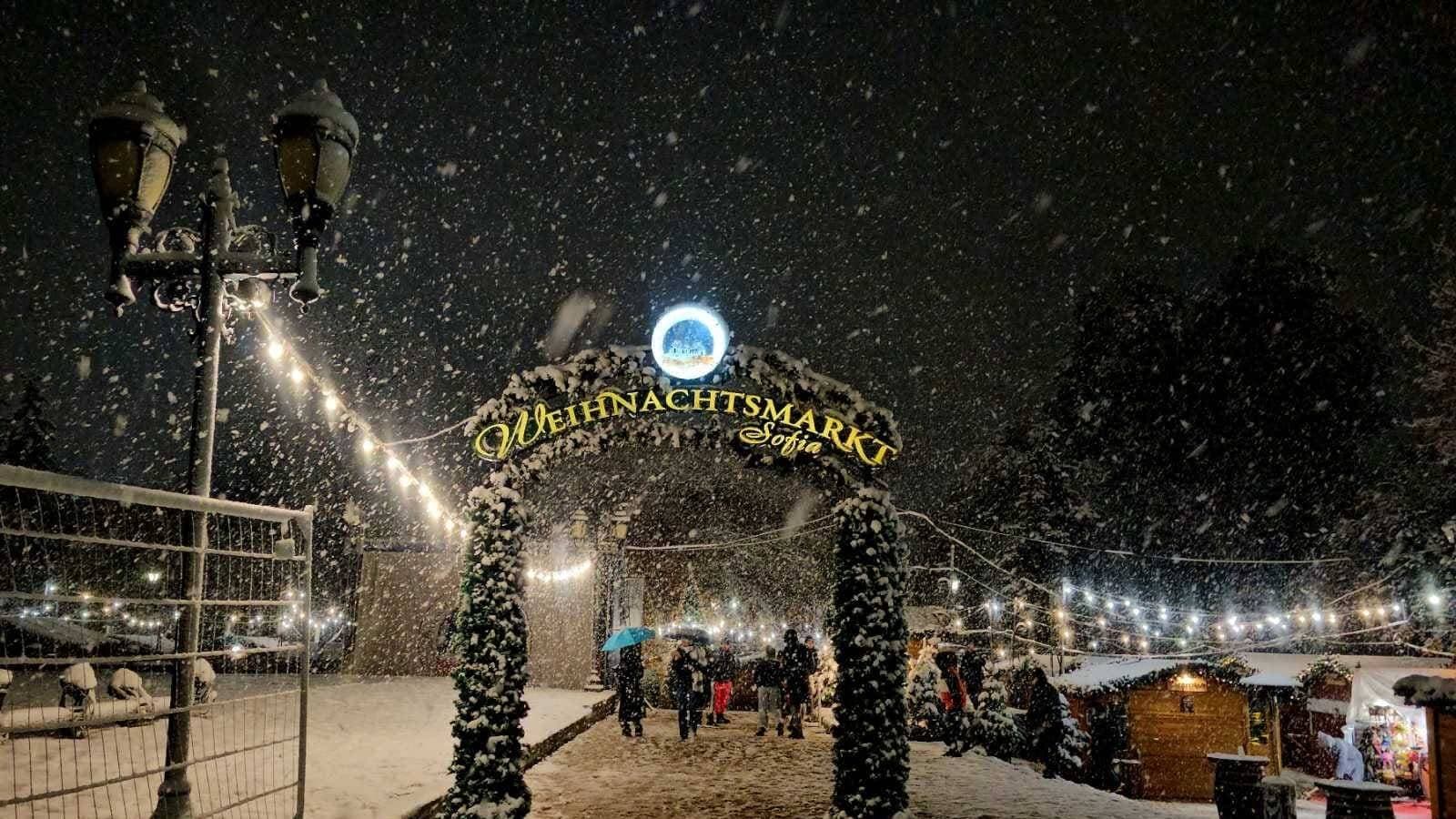 The German Christmas Market in Sofia's City Garden, lit up on a winter evening