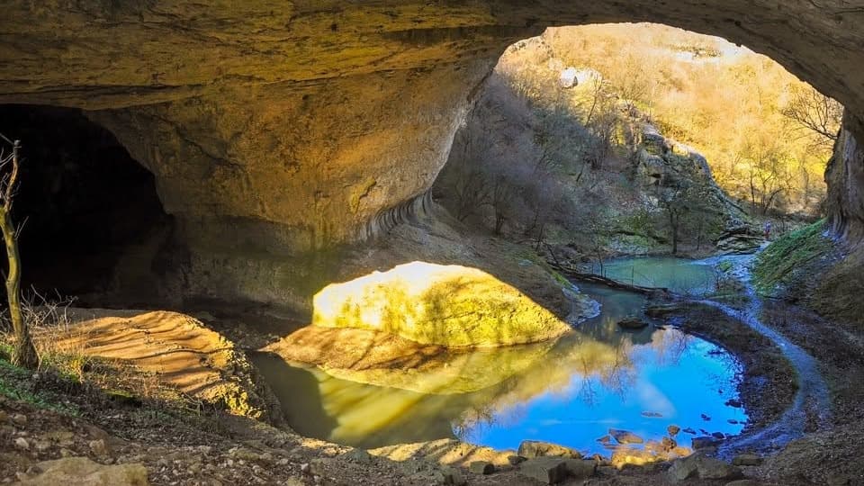 The God's Bridge rock arch spanning the streambed, the remains of a collapsed cave roof