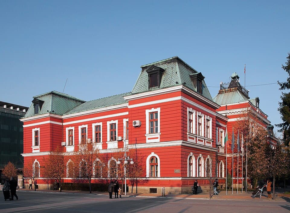 Kyustendil's red-and-white town hall on a clear autumn day