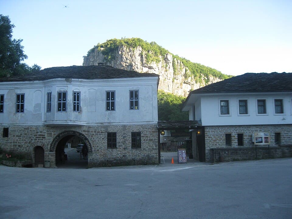 The gate range of Dryanovo Monastery below the limestone cliffs of the Andaka gorge